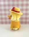 Peluche pince-doigt canard / poussin jaune à chapeau