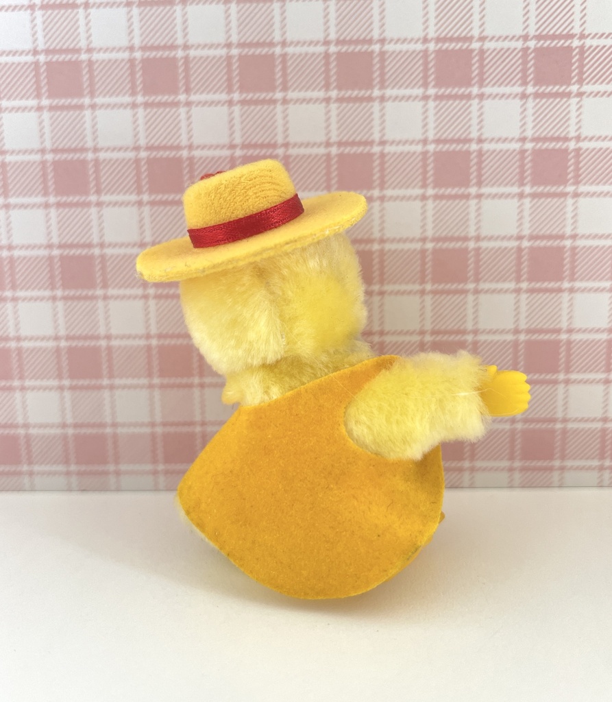 Peluche pince-doigt canard / poussin jaune à chapeau